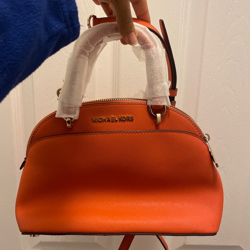 Very orange leather MK bag with tags attached. Has never ever been worn!